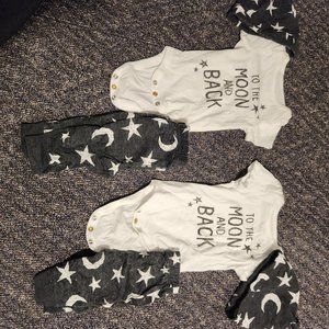 6 matching twin sets and 2 pair of black pants. NEWBORN SIZE. GOOD CONDITION